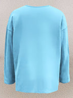Olivira - Loose-fitting top with a nature-inspired floral pattern