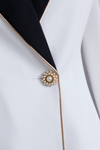 Kaenisse - Elegant White Asymmetrical Blazer with Black Lapels